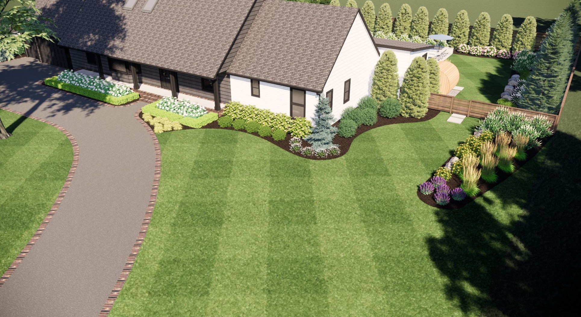 Aerial view of a house with manicured lawns, vibrant flower beds, and a curved driveway, surrounded by neatly trimmed hedges and trees.