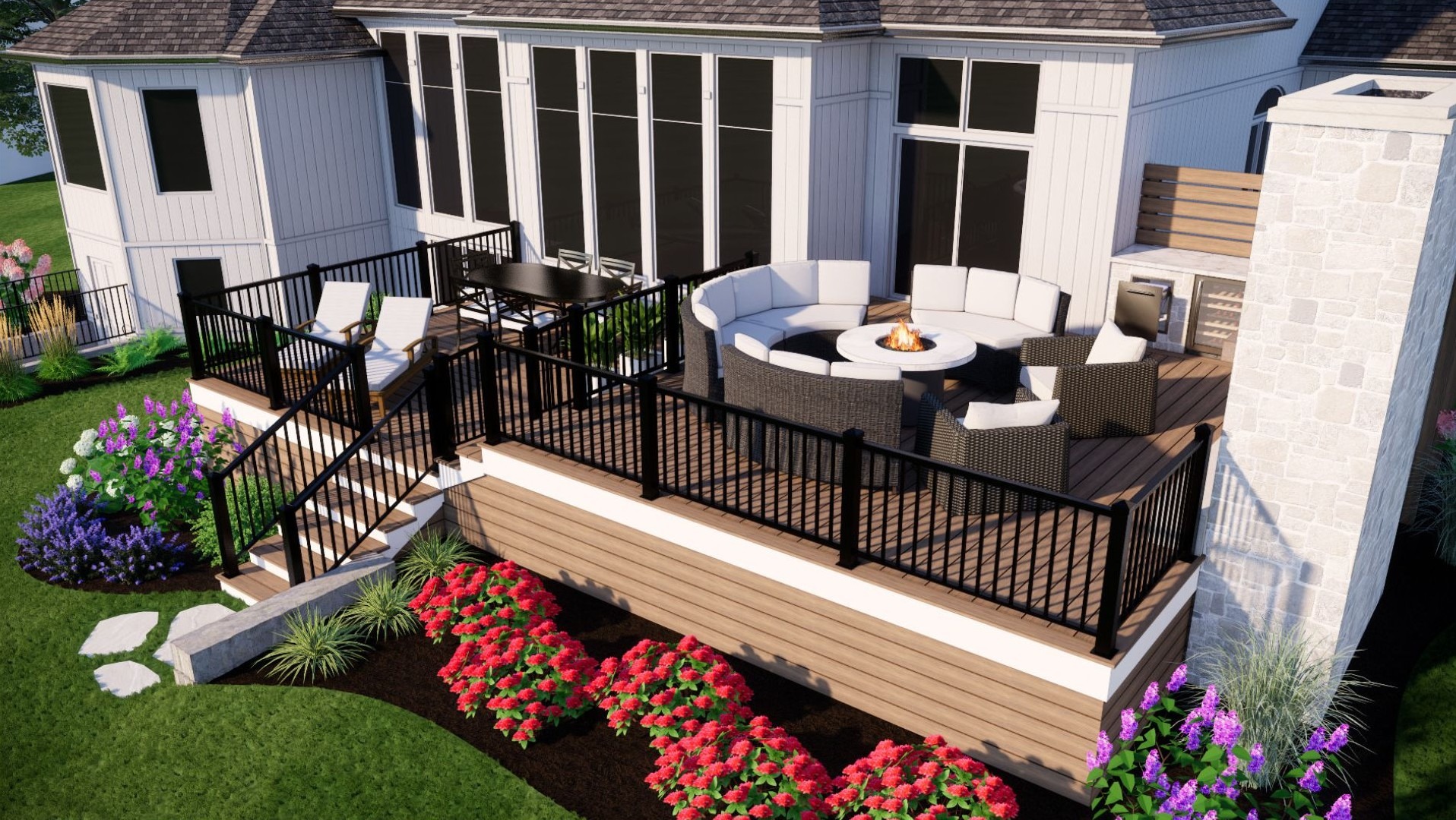 Modern backyard deck features couches around a fire pit, dining table, and vibrant flower garden for an inviting outdoor space.